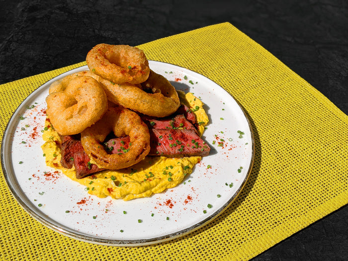 Pan-Seared Flat Iron Steak with Corn Cream and Beer-Battered Onion Rings